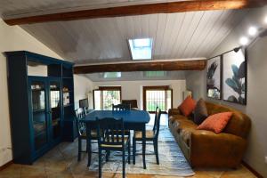 a living room with a couch and a table at Agriturismo La Filanda in Manerba del Garda
