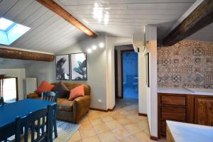a living room with a couch and a table at Agriturismo La Filanda in Manerba del Garda