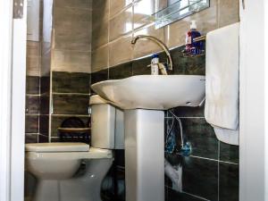 a bathroom with a sink and a toilet at Marilyn Studio with Sea View Wi Fi in Hurghada +91 photos
