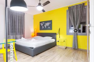 A bed or beds in a room at Colorful Boccaccio Apartment