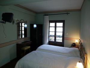 Posteľ alebo postele v izbe v ubytovaní Guesthouse Agonari