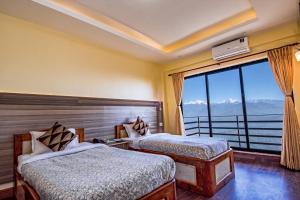 Llit o llits en una habitació de Hotel Green Valley Nagarkot