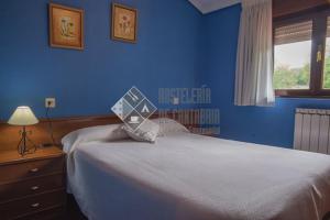 A bed or beds in a room at Hostal casa lucas