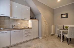 Virtuvė arba virtuvėlė apgyvendinimo įstaigoje Giotto suite