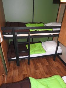 a group of bunk beds in a room at Camping Les Lavandes in Darbres