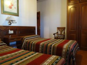 Postel nebo postele na pokoji v ubytování Hostal Rural Poqueira