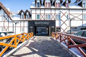 a building with a bridge in front of it at HostGost at Kraljevi Čardaci in Kopaonik