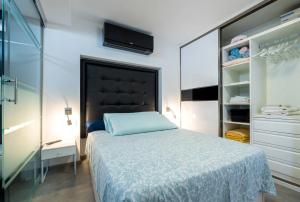 Posteľ alebo postele v izbe v ubytovaní Ciudad Blanca Apartment