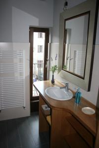 a bathroom with a sink and a mirror and a window at Gure Idorpea in Lesaka