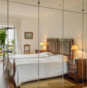 Кровать или кровати в номере Vila Vicência