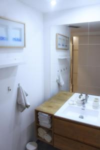a bathroom with a sink and a mirror at Apartment Anna - FREE pickup from OR dropoff to Zagreb airport, please give three days advance notice - EV station - Long-term parking with airport transport possibility in Velika Gorica