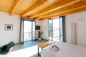 a bedroom with a bed and a table at Boutique BnB Dolcevita in Palermo