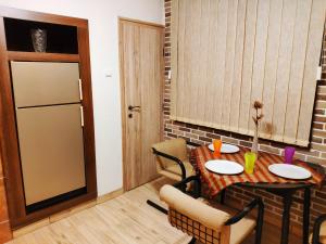 a small dining room with a table and chairs at V2 with Love - Vintage Modern and Spacious in Belgrade