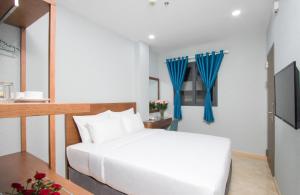 Postel nebo postele na pokoji v ubytování PIANO HOTEL