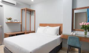 Postel nebo postele na pokoji v ubytování PIANO HOTEL