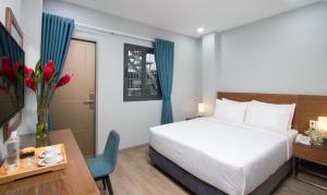 Postel nebo postele na pokoji v ubytování PIANO HOTEL