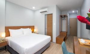 Postel nebo postele na pokoji v ubytování PIANO HOTEL