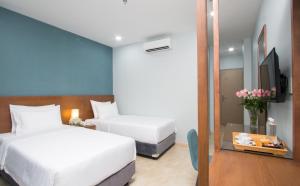 Postel nebo postele na pokoji v ubytování PIANO HOTEL