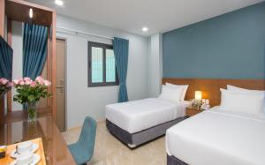 Postel nebo postele na pokoji v ubytování PIANO HOTEL