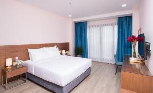 Postel nebo postele na pokoji v ubytování PIANO HOTEL