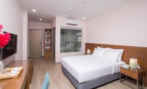 Postel nebo postele na pokoji v ubytování PIANO HOTEL