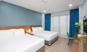 Postel nebo postele na pokoji v ubytování PIANO HOTEL