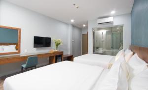 Postel nebo postele na pokoji v ubytování PIANO HOTEL