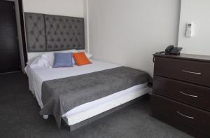 Postel nebo postele na pokoji v ubytování Hotel Grand H&R