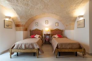 Postel nebo postele na pokoji v ubytování Carpe Diem B&B e Case Vacanza
