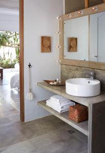 a bathroom with a sink and a mirror at Diniview Villa Resort in Boracay