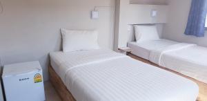 Ein Bett oder Betten in einem Zimmer der Unterkunft Thapae Gate Lodge