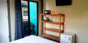 Ein Bett oder Betten in einem Zimmer der Unterkunft Thapae Gate Lodge