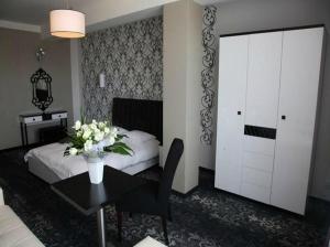 Łóżko lub łóżka w pokoju w obiekcie Hotel Europa