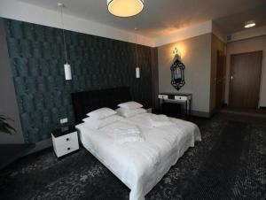 Łóżko lub łóżka w pokoju w obiekcie Hotel Europa