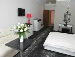 Łóżko lub łóżka w pokoju w obiekcie Hotel Europa