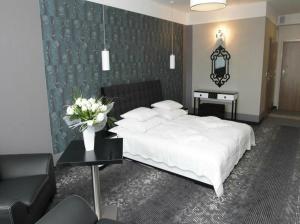 Łóżko lub łóżka w pokoju w obiekcie Hotel Europa