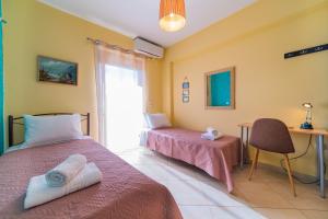 Ένα ή περισσότερα κρεβάτια σε δωμάτιο στο Deluxe Villa Kamba with Sea View