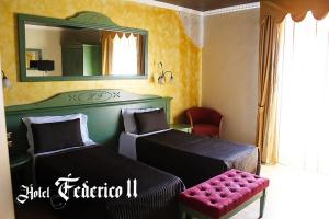 Voodi või voodid majutusasutuse Hotel Federico II toas