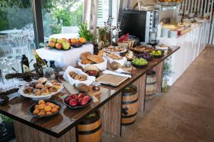 a buffet with many different types of food on it at Boutique Hotel Life in Rogoznica