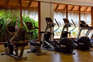 a row of exercise bikes in a gym at Milaidhoo Maldives in Baa Atoll