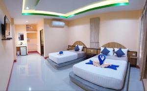 Voodi või voodid majutusasutuse Toongyoong Longbeach Resort SHA Plus toas