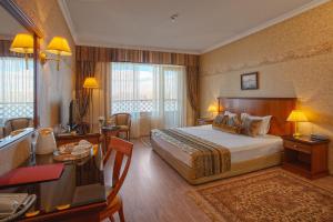 Postel nebo postele na pokoji v ubytování Drustar Hotel + 37 fotografií