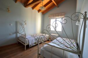 Postel nebo postele na pokoji v ubytování Villa Theodora View Apartments Zeys