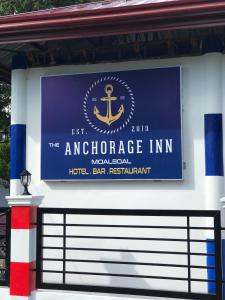 a sign for the entrance to the american embassy in inn at ANCHORAGE INN Moalboal in Moalboal
