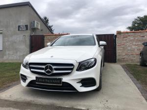 a white mercedes benz car parked in a driveway at Alex Lodge in Zrenjanin