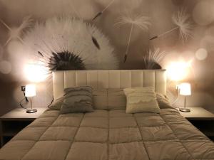 Llit o llits en una habitació de RAJA ROOMS