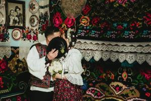a man and woman hugging each other in a room at Casa MYM in Moisei
