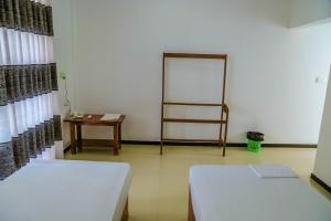 Letto o letti in una camera di Sunstar Nilaveli