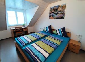 Postel nebo postele na pokoji v ubytování BodenSEE Haus am Geissbock