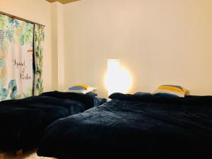 Ліжко або ліжка в номері Midtown Sakura Apartment House 101 予約者だけの空間 A space just for you